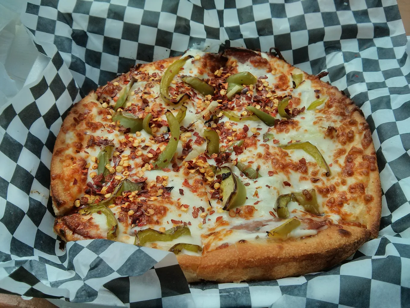 Assorted halal specialty pizzas in Old Strathcona, Edmonton
